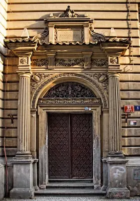 a building with an arch over a door at Riverside Apartment in Prague