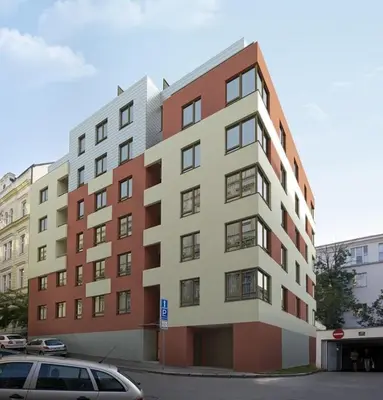 a tall building with a car parked in front of it at Garden apartment with garage in central Prague in Prague