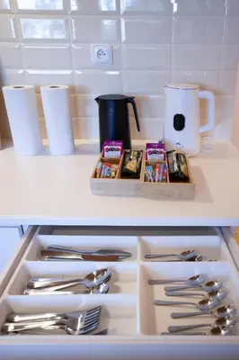 a drawer in a kitchen with silver utensils at Apartmány Mind Adventure in Lštění