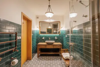 a bathroom with a sink and a mirror at Apartmány Mind Adventure in Lštění