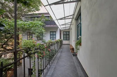 a hallway of a house with a balcony with plants at Jeruzalémská - Synagogue Apartments in Prague