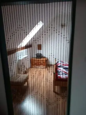 a view of a living room through a glass door at Chalupa u dědy in Dlažkovice