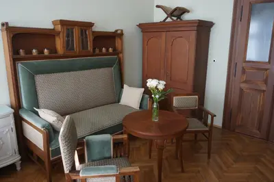 a living room with a table and a chair and a couch at U Obecního dvora - LindasFlat Apartment - Old Town Prague in Prague