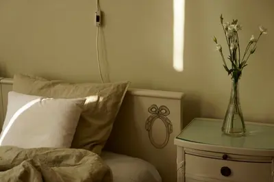 an unmade bed in a room with two night stands at U Obecního dvora - LindasFlat Apartment - Old Town Prague in Prague