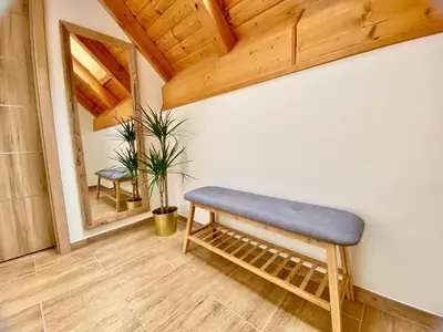 a bedroom with a bed and a wooden ceiling at Relax Apartment in Prague