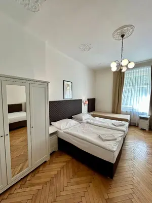a bedroom with a large bed in a room at Prague Central Exclusive Apartments in Prague