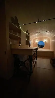 a room with a table with lights on it at Glamping - stylová maringotka v srdci Ladova kraje, poblíž hlavního města Prahy in Stříbrná Skalice