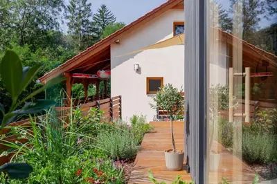 a house with a view of a garden at Slapy Chata Hrdlička in Čím