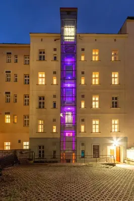 a building with purple lights in front of it at S42 Hotel Prague in Prague