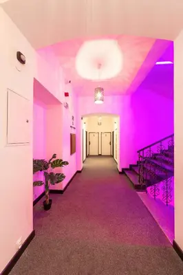 a hallway with pink walls and a purple ceiling at S42 Hotel Prague in Prague