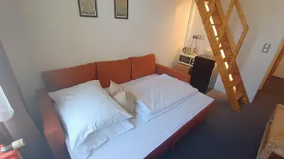 a couch with pillows on it in a room at S42 Hotel Prague in Prague