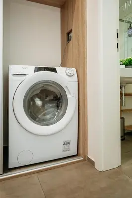 a washer and dryer sitting in a room at Prague Days - Premium Studios w Stunning Terraces - Easy City Access in Prague