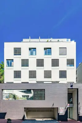 an apartment building with a white facade at Prague Days - Premium Studios w Stunning Terraces - Easy City Access in Prague