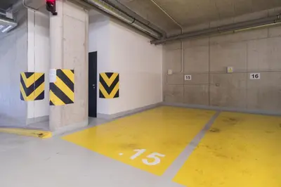a parking garage with a yellow floor in a room at Prague Days - Premium Studios w Stunning Terraces - Easy City Access in Prague