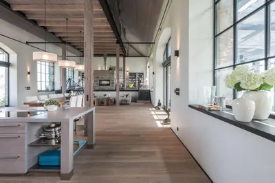 an open kitchen with a long hallway with windows at Šťastná Samota in Vrchotovy Janovice