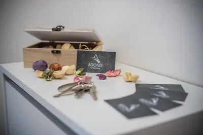 a table with a box and some shells on it at Holiday House Adonis in Bystřice
