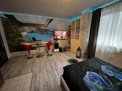 a bedroom with a bed and a desk and a tv at MONFas APARTMENT PROVENCE IN PRAGUE in Prague