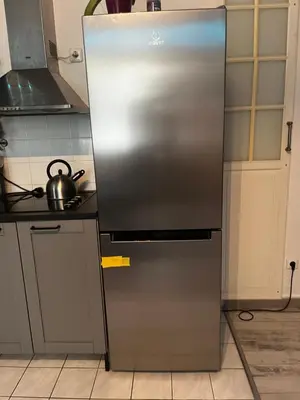 a stainless steel refrigerator in a kitchen at MONFas APARTMENT PROVENCE IN PRAGUE in Prague