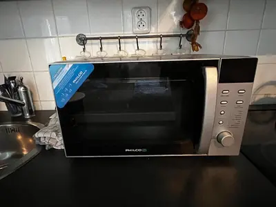 a microwave oven sitting on a kitchen counter at MONFas APARTMENT PROVENCE IN PRAGUE in Prague