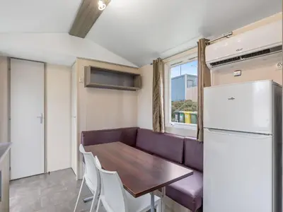a kitchen with a couch and a table and a refrigerator at Holiday Home Prima by Interhome in Prague