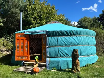 a yurt with a group of teddy bears in the yard at Jurta pod Blaníkem s wellnes in Chotýšany