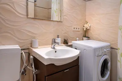 a bedroom with a bed and a table and chairs at Studio Apartment - Tower Petrin in Prague