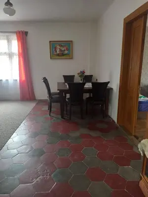 a dining room with a table and chairs at Apartmán Měňany in Měňany
