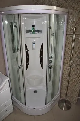 a shower with a glass door in a bathroom at Vila Prag in Prague