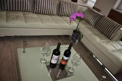 two bottles of wine and two glasses on a table at Vila Prag in Prague