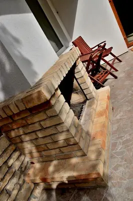 a brick staircase with two wooden benches in a building at Vila Prag in Prague