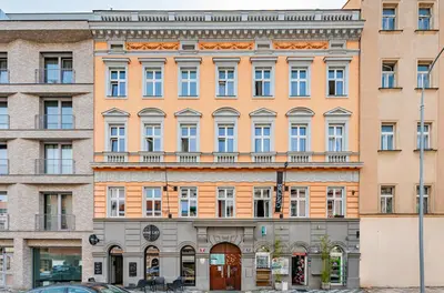 an apartment building in the city of vienna at Prague Days - Stylish Condo with Netflix in Hip Karlín in Prague