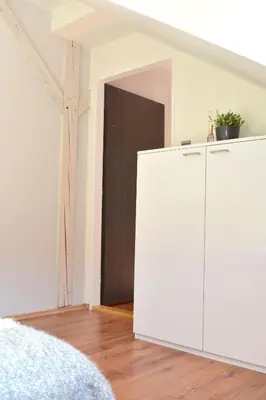 a white cabinet in a room with a door at NEW CENTRAL ROOFTOP with private WELLNESS, Sauna & Whirlpool bath in Prague