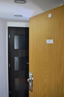 a door with a sign on it next to a door at NEW CENTRAL ROOFTOP with private WELLNESS, Sauna & Whirlpool bath in Prague