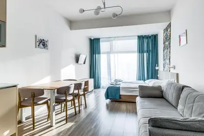 a living room with a couch and a table at Kora Apartments in Prague