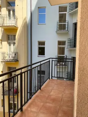 a balcony with a black railing in a building at 3 Bed Flat - Sleeps 10 - Pets - Smoking on terrace in Prague