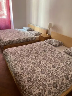 three beds sitting in a room withinylinylinylinyl at 3 Bed Flat - Sleeps 10 - Pets - Smoking on terrace in Prague