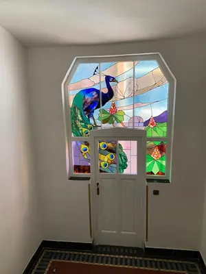 a door with a stained glass window in a room at 3 Bed Flat - Sleeps 10 - Pets - Smoking on terrace in Prague