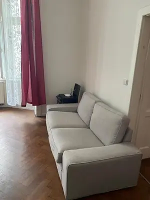 a living room with a couch in a room at 3 Bed Flat - Sleeps 10 - Pets - Smoking on terrace in Prague