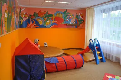 a childs play room with a play tent and a table at Hotel VZ Měřín in Merin