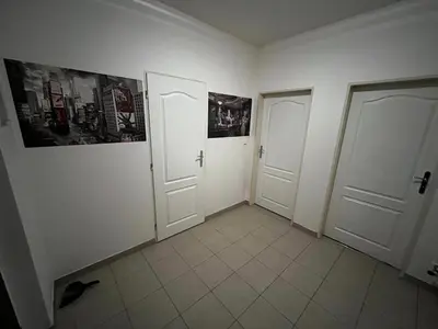 an empty room with two doors and a tiled floor at MONFas APARTMENT GARDEN CITY in Prague