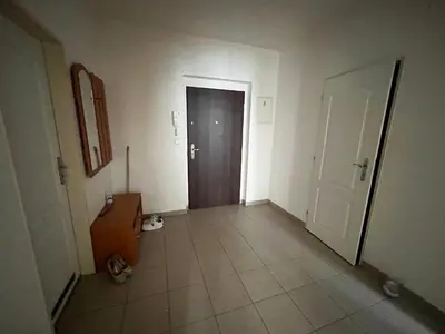 an empty hallway with a door and a tile floor at MONFas APARTMENT GARDEN CITY in Prague