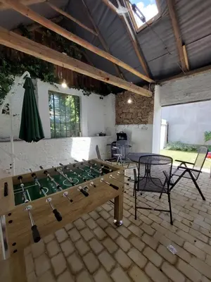 a large room with a pool table and chairs at Modré okno in Kozojedy