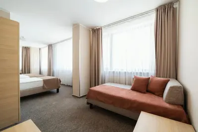 a hotel room with a bed and a window at Hotel Ehrlich Prague in Prague