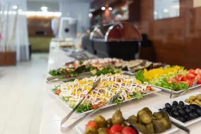 a buffet line with many different types of food at Hotel Ehrlich Prague in Prague