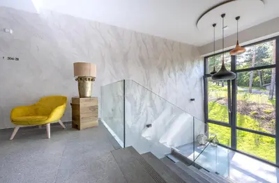 a living room with a couch and a table at Vista Resort & Club in Prague
