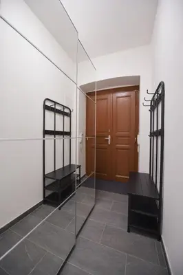 a room with two glass shelves and a door at Pat & Mat Apartment in Prague