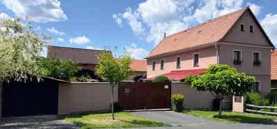 a house with a gate and a fence at Ubytování Bauštel in Kochovice