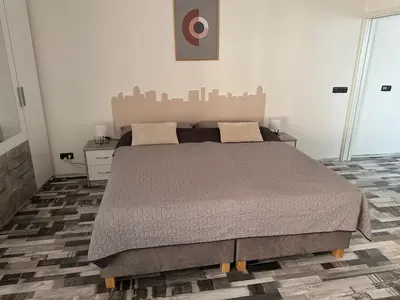 a bedroom with a large bed in a room at Apartmány Piller in Roudnice nad Labem