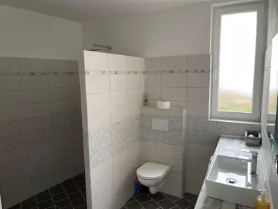a bathroom with a toilet and a sink at Apartmány Piller in Roudnice nad Labem