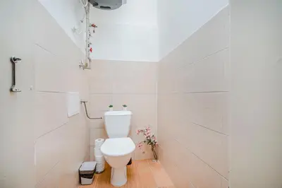 a bathroom with a white toilet in a room at Florenc Apartments Prague 1 by Michal&Friends in Prague